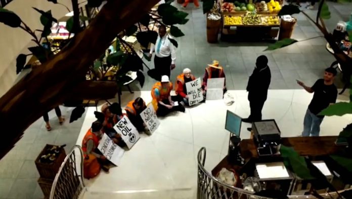 just-stop-oil-activists-stage-sit-down-protest-at-fortnum-&-mason-in-london